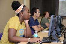 Mixed-gender students at computer