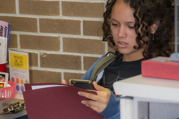 First year female student looking a phone