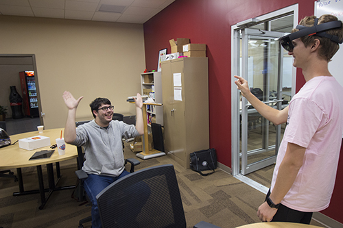 student working with a visual reality glasses
