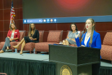 Taylor Williams at podium, L-R Adrianna Swearingen, Tammetrius Farmer, Robyn Evans-4224.png