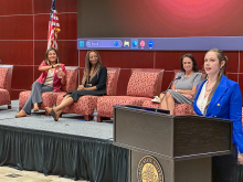 Taylor Williams at podium, L-R Adrianna Swearingen, Tammetrius Farmer, Robyn Evans-6134.png