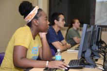 Mixed-gender students at computer