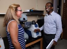 Male ME faculty with female student in lab