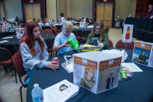 Group table activity, each group receives a plastic bag with the same items to build a raft. Groups are challenged to be able to place at least 50 pennies on the float before it sinks. Participants are encouraged to test their designs, regroup, retest, all a process of engineering.