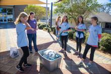 Group table activity, each group receives a plastic bag with the same items to build a raft. Groups are challenged to be able to place at least 50 pennies on the float before it sinks. Participants are encouraged to test their designs, regroup, retest, all a process of engineering.