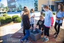 Group table activity, each group receives a plastic bag with the same items to build a raft. Groups are challenged to be able to place at least 50 pennies on the float before it sinks. Participants are encouraged to test their designs, regroup, retest, all a process of engineering.